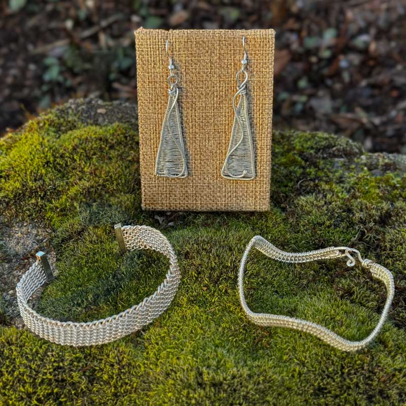 Woven sterling silver bracelets and earrings by Lisa Haake