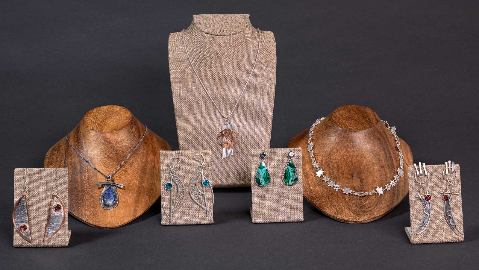  Included in this photo (left to right): Topaz on the Half Shell • Sodalite Teardrop • Natural Order with Topaz • Tree of Life • Malachite Drop • Stars • Dancers with Garnet 