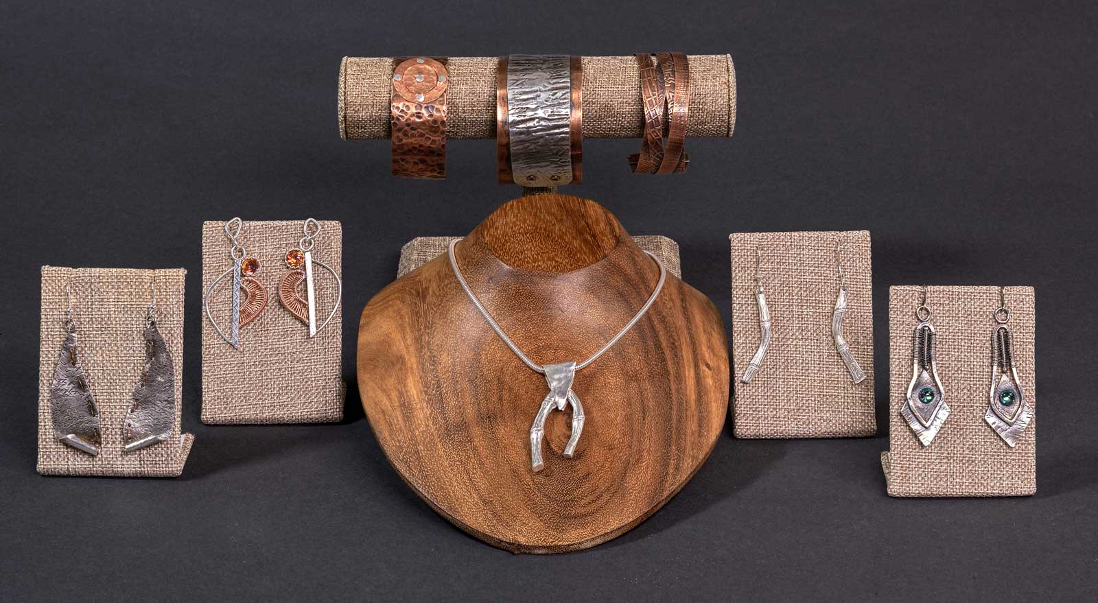  Included in this photo (left to right): Antiqued Stitched Leaf • Natural Order with Topaz • Bamboo Set (necklace & earrings) • Tribal Diamond with Topaz; &nbsp;Bracelets: Druid Circle • Ancient Path • Antique Braid 