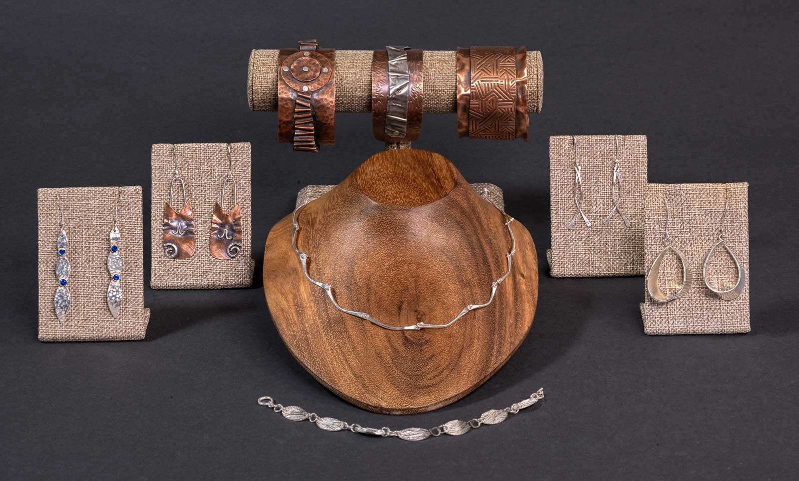  Included in this photo (left to right): Long Leaf with Sapphire · Hello Kitty · River Drops · Peg Necklace & Earrings · Twisted Hoops; &nbsp;Bracelets (left to right):
Druid Circle Rolling Path · Electric Folds · Ruffles Have Ridges 